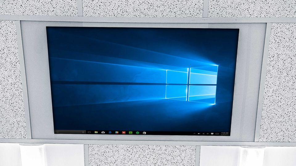 A monitor embedded in the office wall.